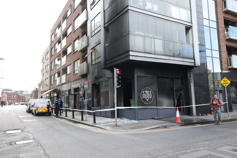 The fire damaged premises, above which apartments are located, was cordoned off on Tuesday morning. Photograph: Bryan O'Brien