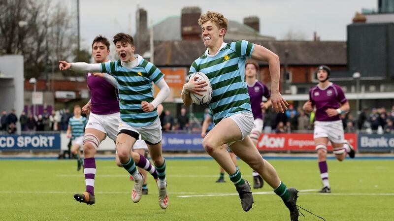 St Gerard’s Craig Kenny on his way to scoring a try. Photograph: Bryan Keane/Inpho