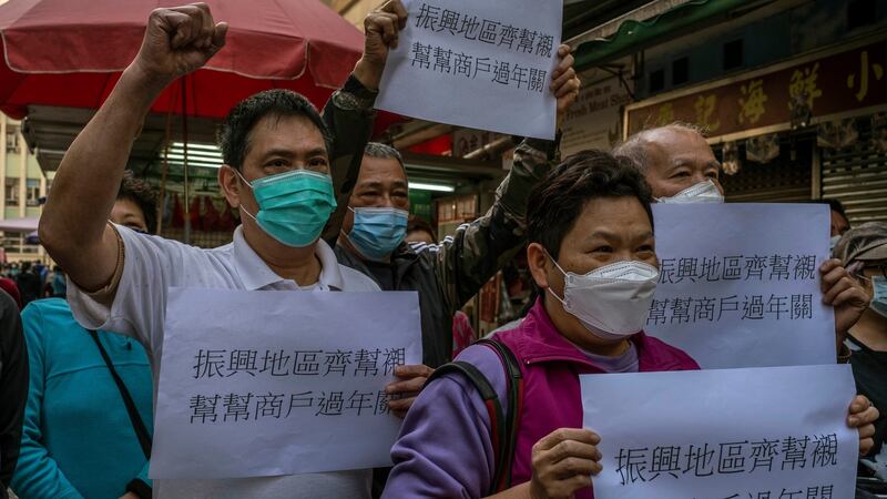 Market stall owners in the Jordan neighbourhood call for economic aid from the government. Photograph:  Lam Yik Fei/The New York Times