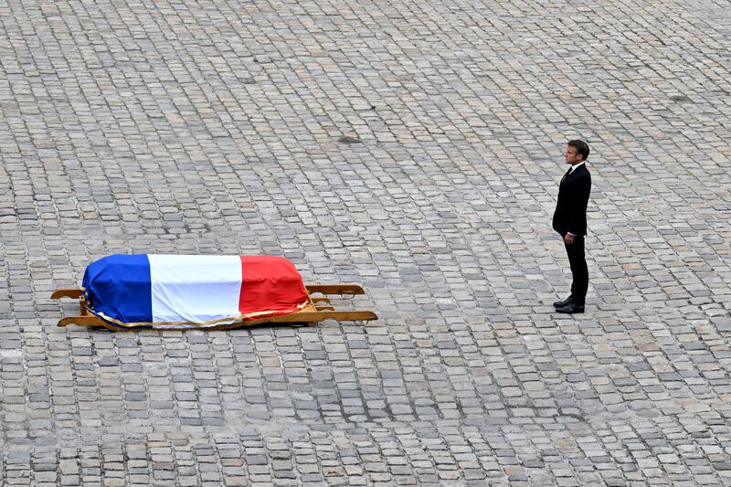Emmanuel Macron beside the coffin of Jean-Louis Georgelin, the former French army chief who was placed in charge of restoring  Notre-Dame. Photograph: Bertrand Guay/AFP/Getty 