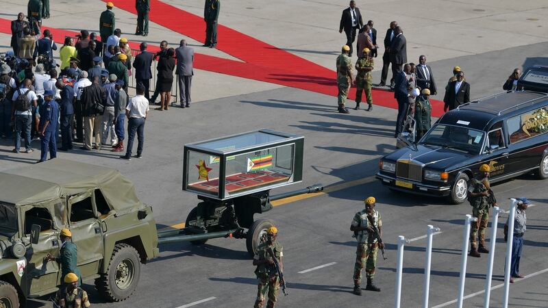 A military ceremonial casket carriage and a hearse line up to transport the casket bearing the body of Robert Mugabe at the Robert Mugabe International Airport in Harare. Photograph: Tony Karumba/AFP/Getty Images