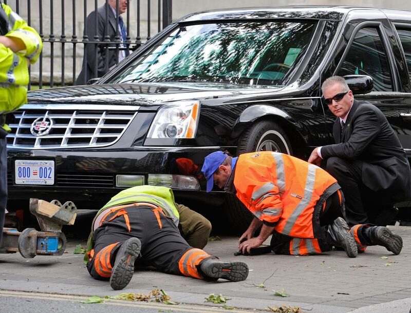 Trapped beast: mechanics try to free the presidential limo after it got stuck on a speed bump on a ramp at the US embassy in Dublin in 2011. Photograph: Dave Meehan