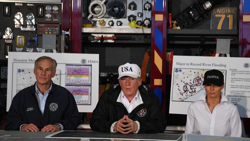 Texas governor Greg Abbott with US president Donald Trump and first lady Melania Trump giving  briefing on  Hurricane Harvey in Corpus Christi, Texas, in August  2017. Photograph: Jim Watson/AFP/Getty Images