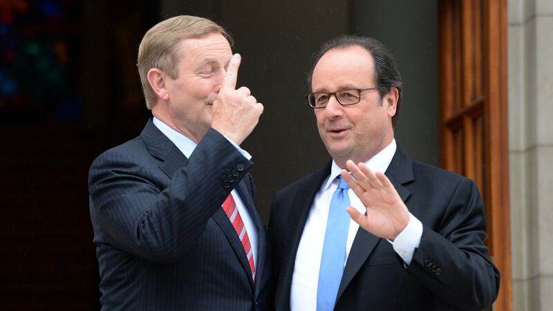 French president François Hollande (right) is greeted by Taoiseach Enda Kenny at Government Buildings Dublin on Thursday. Photograph: Eric Luke/The Irish Times