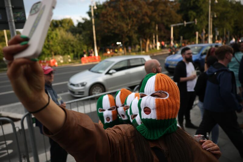 Fans take selfies before the Kneecap concert in Dublin's Fairview Park on Thursday. Photograph: Chris Maddaloni
