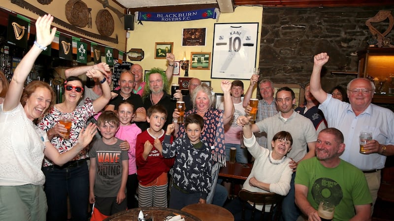 Celebrations as fans watch the FIFA World Cup quarter final between Sweden and England at Molly’s Bar in Letterfrack, Galway. Photograph: Hany Marzouk/PA Wire