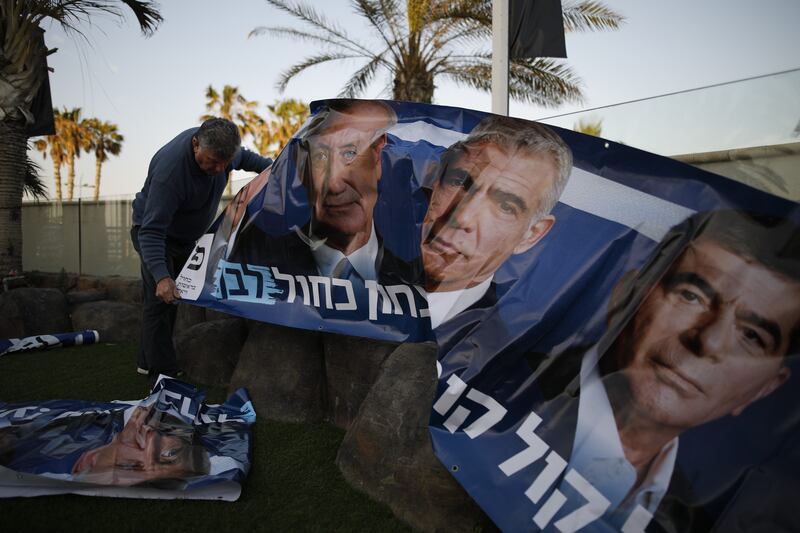 Election campaign posters for Israel’s Blue and White party, featuring Benny Gantz (left), Yair Lapid (centre) and Gabi Ashkenazi in Ashkelon, Israel, in April 2019. Photograph: Corinna Kern/The New York Times