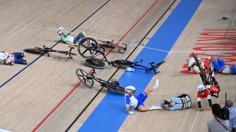 Britain’s Laura Kenny, Ireland’s Emily Kay, France’s Clara Copponi, Belgium’s Lotte Kopecky, Egypt’s Ebtissam Zayed Ahmed, Poland’s Daria Pikulik and Italy’s Elisa Balsamo crash during the women’s track cycling omnium scratch race. Photo: Greg Baker/AFP via Getty Images