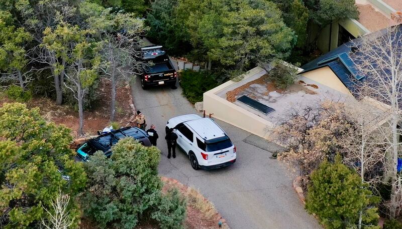 Law enforcement officials outside the home of actor Gene Hackman and Betsy Arakawa. Photograph: Roberto Rosales/AP