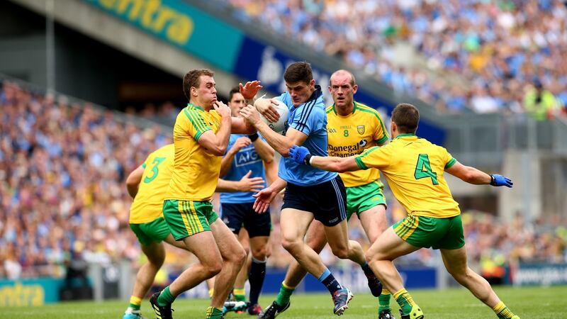 Dublin’s Diarmuid Connolly is challenged by  Eamonn McGee, Neil Gallagher and Paddy McGrath of Donegal during the 2014 All-Ireland SFC semi-final at Croke Park. Photograph: James Crombie/Inpho