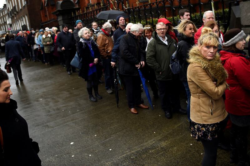 Members of the public queue to see the coffin of late Cranberries singer Dolores O'Riordan as it is carried into St Joseph's Church for a public reposal in Limerick in 2018. Photograph: Clodagh Kilcoyne/Reuters