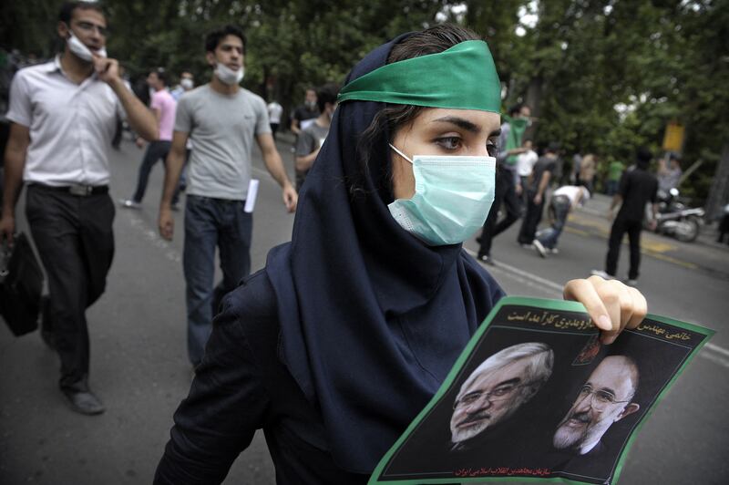 A supporter of defeated Iranian presidential candidate Mir Hossein Mousavi during protests in Tehran in June 2009 in the wake of the re-election of then president  Mahmoud Ahmadi-Nejad. Photograph: Olivier Laban-Mattei/AFP via Getty Images