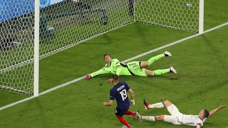 Karim Benzema scores a goal which would later be ruled out fof offside. Photograph: Alexander Hassenstein/Getty/AFP