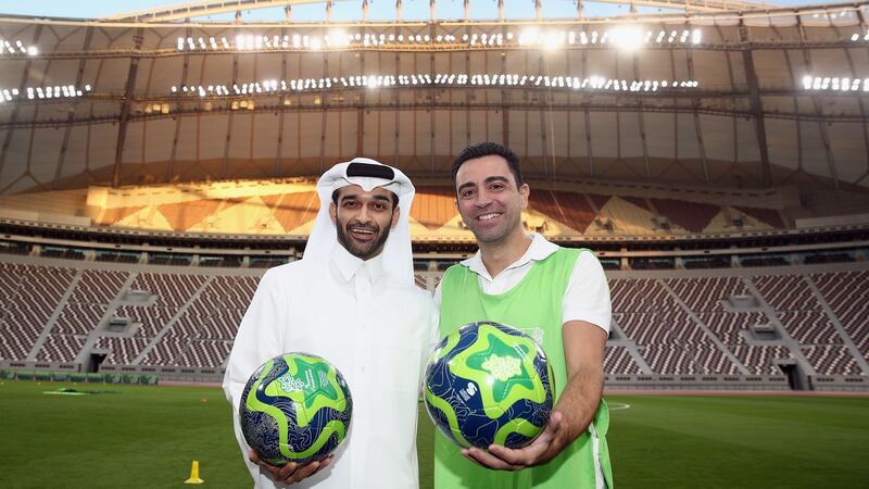 Hassan Al Thawadi, the Secretary General of the Qatar’s Supreme Committee for Delivery and Legacy (SC) poses with former Spanish footballer and World Cup 2022 ambassador Xavi during a presentation at the at Khalifa International Stadium in Doha, Qatar. Photo: Alex Grimm/Bongarts/Getty Images