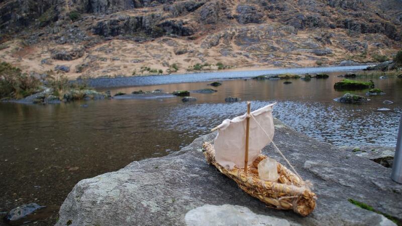Billy Mag Fhloinn and his wife Muireann Nic Amhlaoibh sent a lit candle in a small boat onto a lake in Kerry to mark the birth of their daughter Sadhbh.