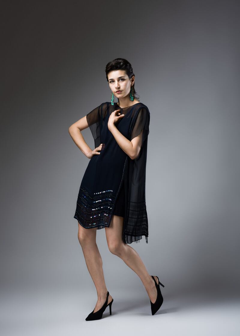 Black Magic chiffon panel sequin embellished tunic €270, Ava long cami top worn underneath €65 Hot Knickers Lingerie. Slip skirt stylist’s own, handpainted earrings €70 Kiki Na Art at Om Diva, shoes €30 TK Maxx