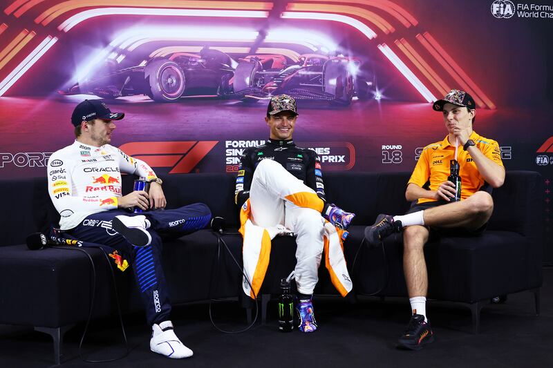 Red Bull's Max Verstappen (left) with McLaren's Lando Norris and Oscar Piastri at the drivers press conference following the Singapore Grand Prix. Photograph: Clive Rose/Getty Images