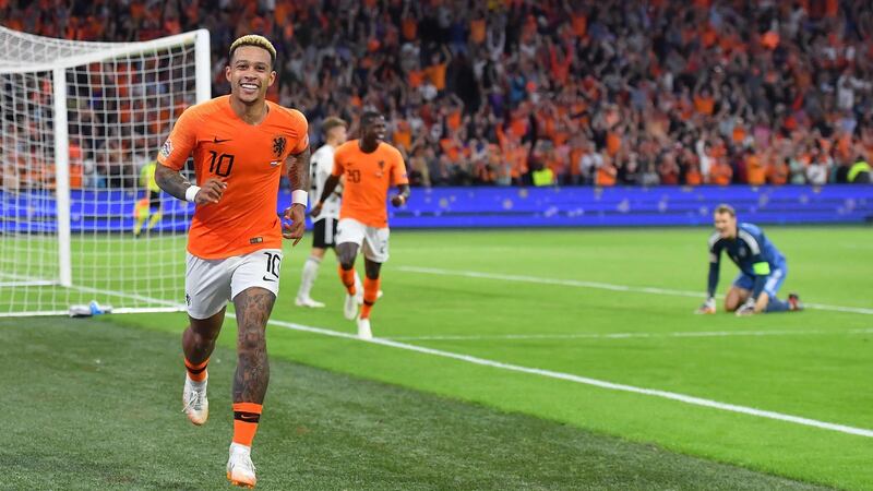 Memphis Depay celebrates his goal in Holland’s 3-0 win over Germany. Photograph: Emmanuel Dunand/AFP/Getty