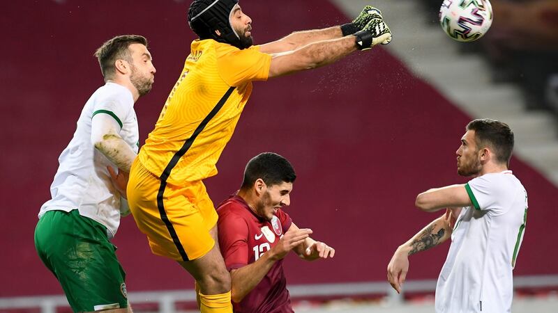 Shane Duffy challenges Qatar goalkeeper  Saad Al Seeb. Photograph: Zsolt Czegledi/EPA