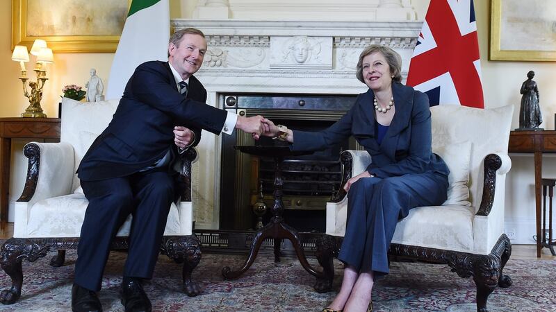 British prime minister Theresa May shakes hands with Taoiseach Enda Kenny  in the White Room during their meeting at 10 Downing Street in London, Britain. Photograph: Andy Rain/EPA