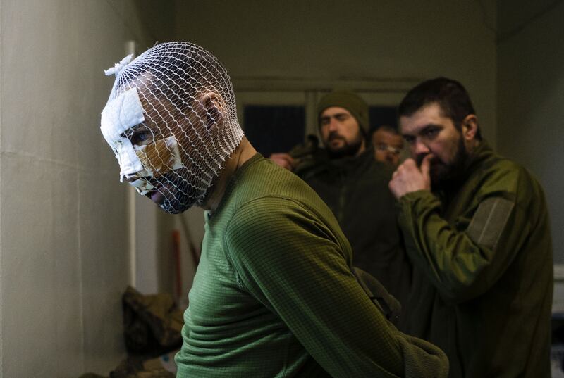 A wounded Ukrainian soldier  at a stabilisation point near the frontline city of Pokrovsk, Donetsk region. Photograph: Sergey Shestak/EPA
