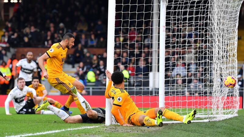 Romain Saiss of Wolverhampton Wanderers scores at Craven Cottage. Photograph: Justin Setterfield/Getty Images