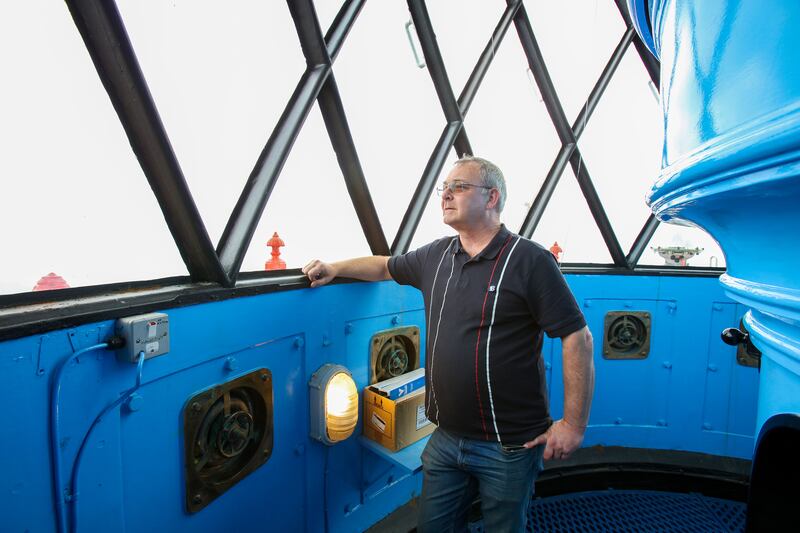 Phil Lawlor of Irish Lights inside Blackhead Lighthouse on the east coast of Co Antrim Photograph: Paul Faith
