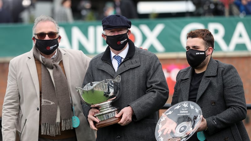 Alex Ferguson, owner of Clan Des Obeaux, collects the trophy after winning the Betway Bowl Chase to complete a hat trick of wins in the first three races  at Aintree. Photo: David Davies/PA Wire
