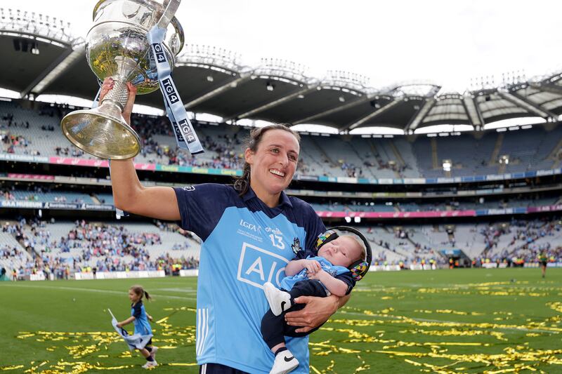 Dublin's Hannah Tyrrell celebrates after the All-Ireland final victory over Kerry with her daughter, seven-week-old Aoife. Photograph: Laszlo Geczo/Inpho 