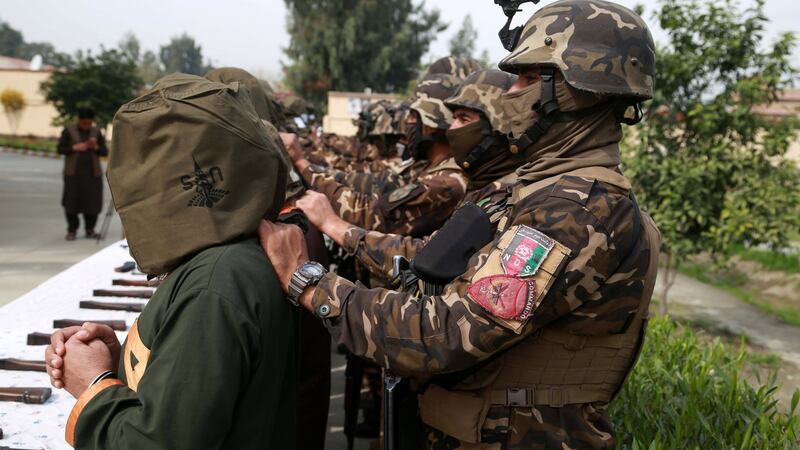 Afghan security officials show a group of suspected militants allegedly accused of planning attacks on government and security forces after their arrest from different areas, in Jalalabad, March 10th. Photograph: Ghulamullah Habibi/EPA
