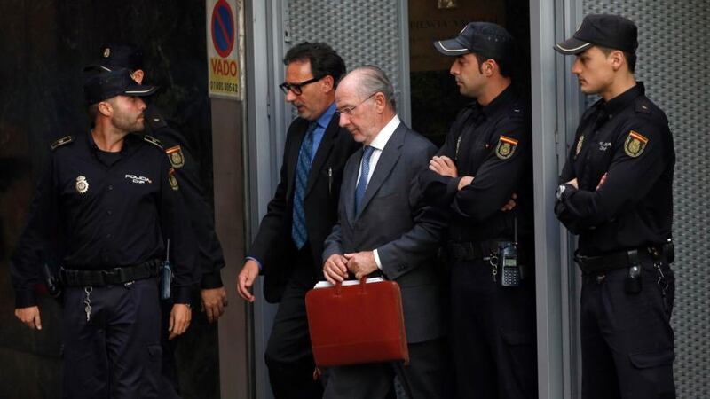 Rodrigo Rato, former chairman of Spain’s Bankia bank, leaves the High Court in Madrid after being questioned by a judge investigating the alleged use of Caja Madrid credit cards for personal expenses. Photograph: Susana Vera/Reuters