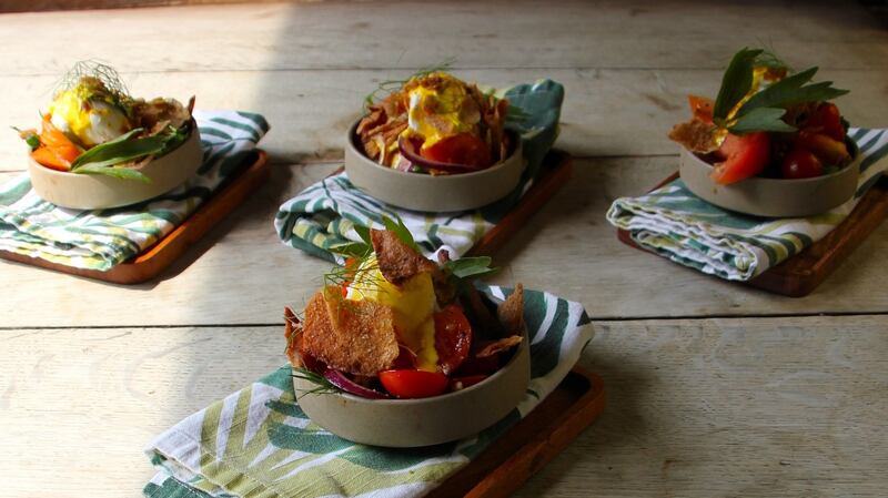 Vine tomato fattoush with poached eggs and saffron yoghurt.