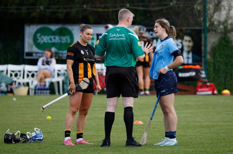 Kilkenny captain Katie Power and Dublin's Aisling Mahe, both in shorts, with referee Ray Kelly before a match. When the players later returned to the pitch they were all in their camogie skorts.  Photograph Nick Bradshaw
