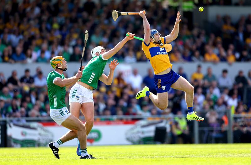 Limerick’s Dan Morrissey and Kyle Hayes tackle Shane O’Donnell of Clare. Limerick scored three goals in the blink of a second-half eye. Photograph: James Crombie/Inpho