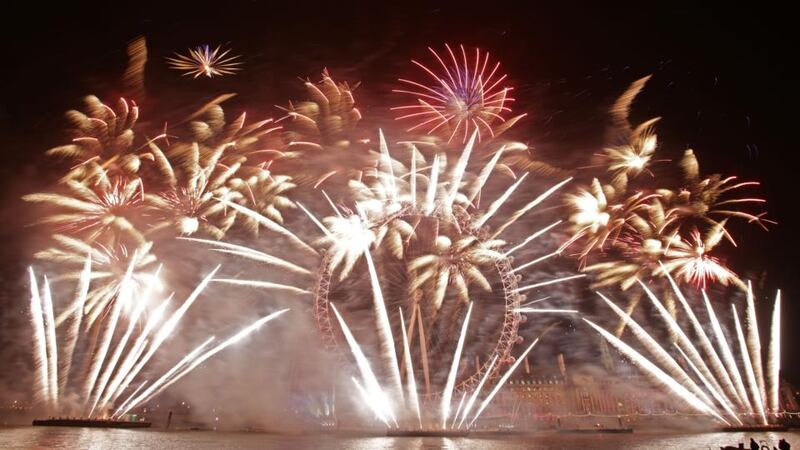 Fireworks light up the sky over the London Eye in central London during the New Year celebrations. Photograph: Yui Mok/PA Wire
