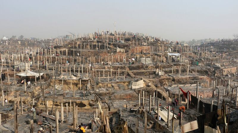 Rohingya refugees  at the site of Monday’s fire at a  camp in Balukhali, southern Bangladesh. Photograph: Shafiqur Rahman/AP