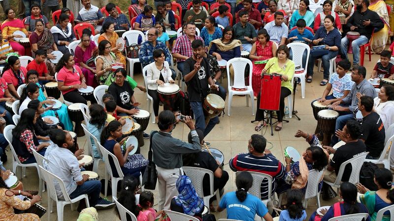 Children with autism and their relatives participate in a drum performance during an event on the eve of ‘World Autism Awareness Day’ organized by ‘wiztara trust’ NGO in Bangalore, India. Photograph: Jagadeesh HV/EPA