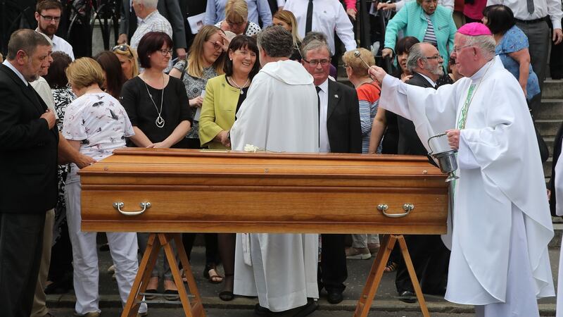 Bishop John McAreavey (right) during the  funeral of Seamus Ruddy. Photograph: Niall Carson /PA Wire