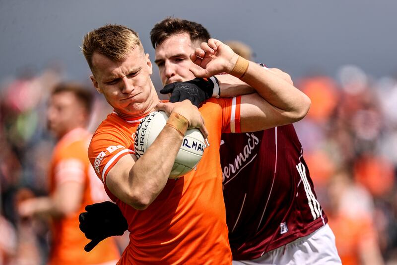 Armagh's Rian O'Neill is tackled by Cein Darcy of Galway during the sides' encounter in June. Photograph: Ben Brady/Inpho