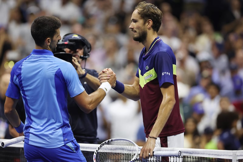 Novak Djokovic hugs Daniil Medvedev of Russia after defeating him in their men's singles Final match.  Photograph: Matthew Stockman/Getty Images