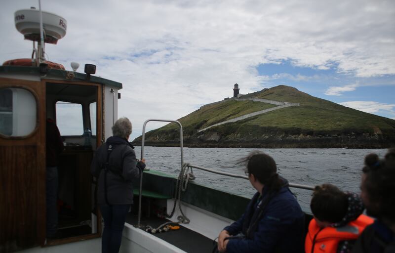 Tourists make their way towards Ballycotton Lighthouse in east Cork. Photograph: Bryan O Brien