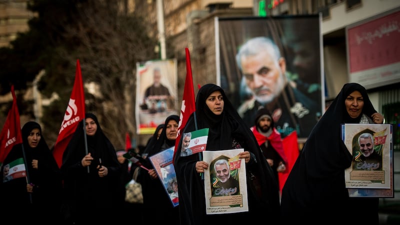 Mourners carry images of Iranian general Qassem Suleimani during the funeral ceremony in Tehran. Photograph: Ali Mohammadi/Bloomberg