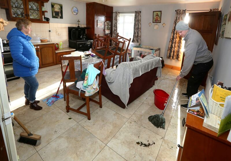 Deirdre Burke and her son Colm clean up her house in Garraun, Oranmore after flooding. Photograph: Joe O'Shaughnessy