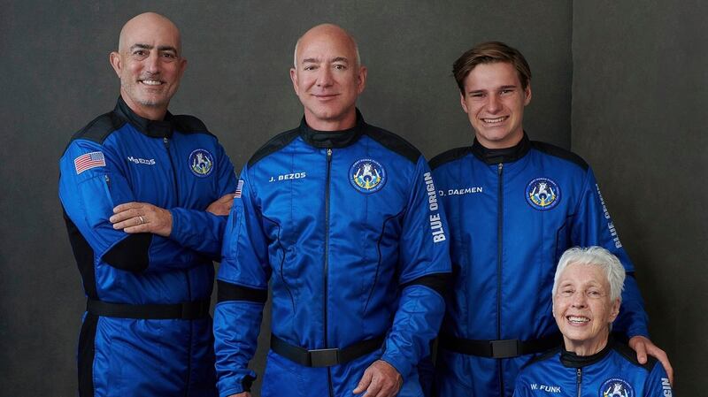 From left to right: Mark Bezos, brother of Jeff Bezos; Jeff Bezos, founder of Amazon and space tourism company Blue Origin; Oliver Daemen, of the Netherlands; and Wally Funk, aviation pioneer from Texas, pose for a photo. Photograph:  Blue Origin via AP