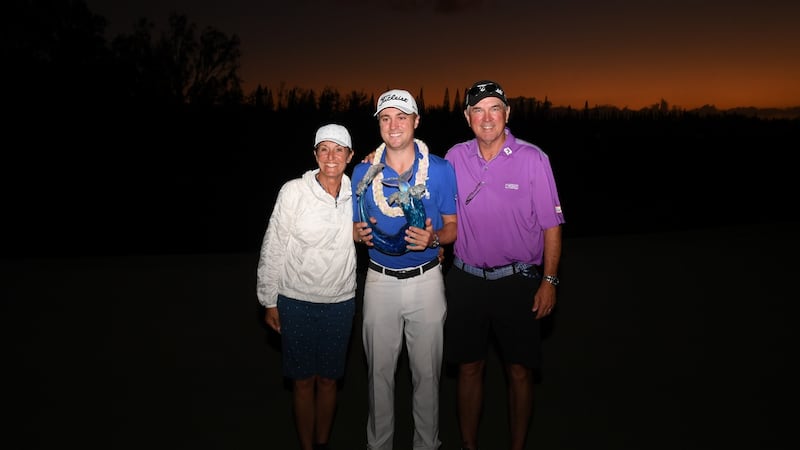 Justin Thomas  celebrates with his parents Mike and Jani and the winner’s trophy during the final round of the Sentry Tournament Of Champions at the Kapalua Plantation Course on January 5th, 2020. Photograph: Harry How/Getty Images