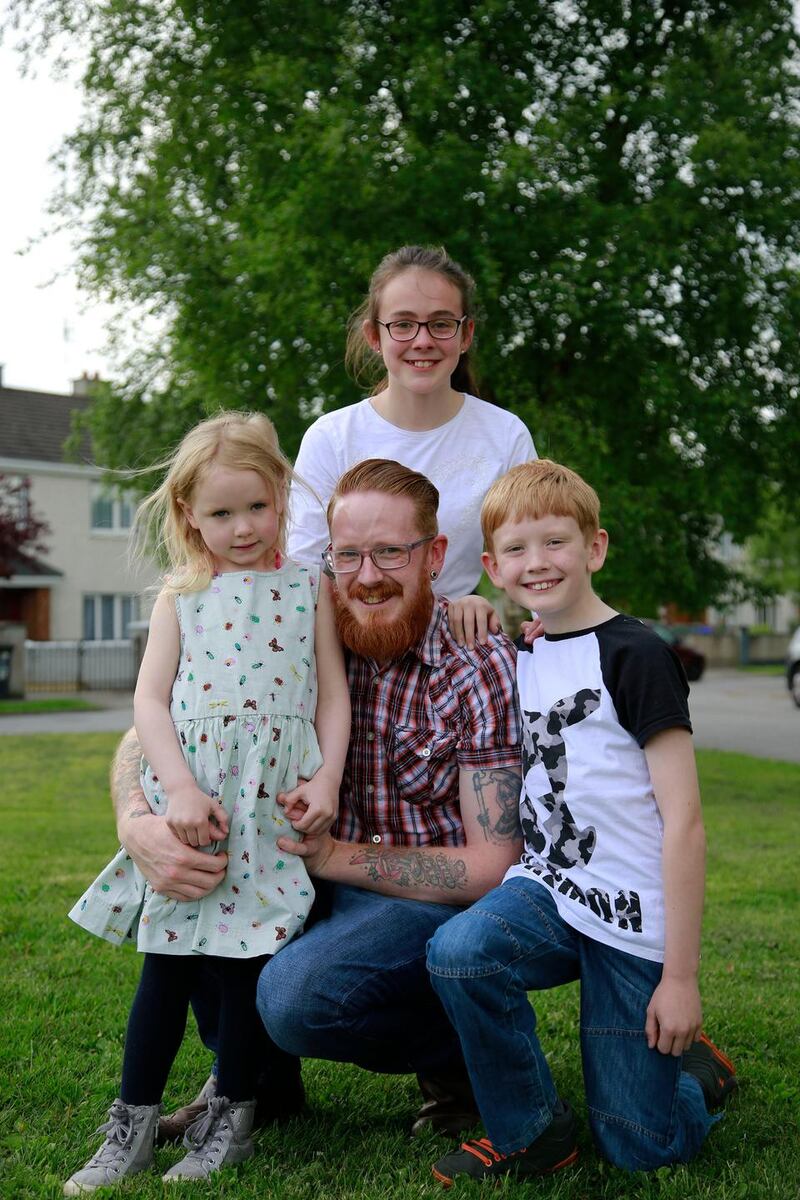 Kevin Dunne with children Robyn (4), Ellie (12) and Daniel (9). Photograph: Nick Bradshaw