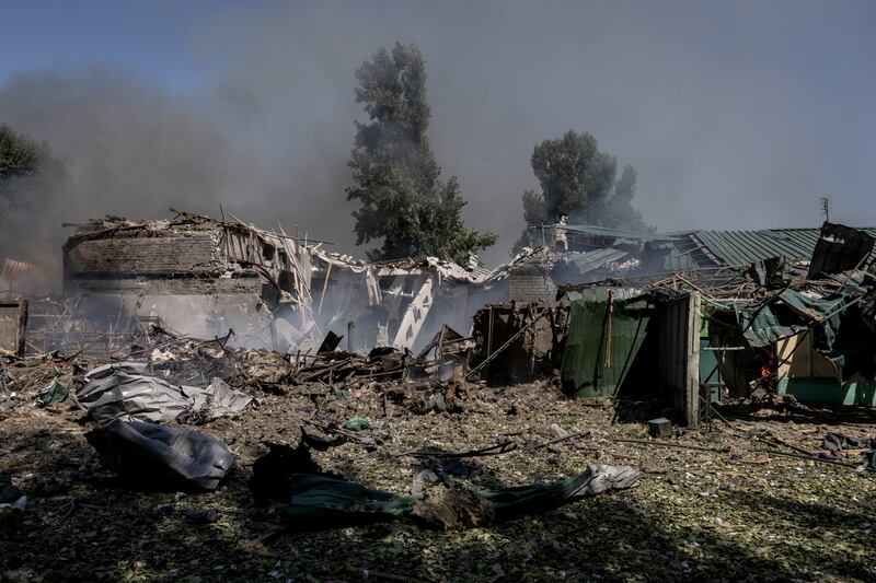 Buildings damaged by a Russian glide bomb burn at a town in the Pokrovsk area last month. Photograph: Finbarr O’Reilly/The New York Times