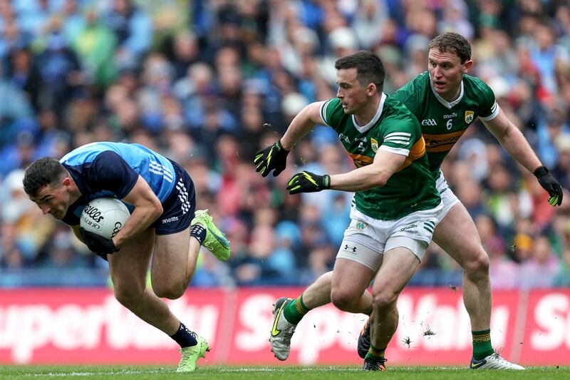 Dublin's Colm Basquel with Paul Murphy and Tadhg Morley of Kerry
in close attendance. Photograph: Laszlo Geczo/Inpho