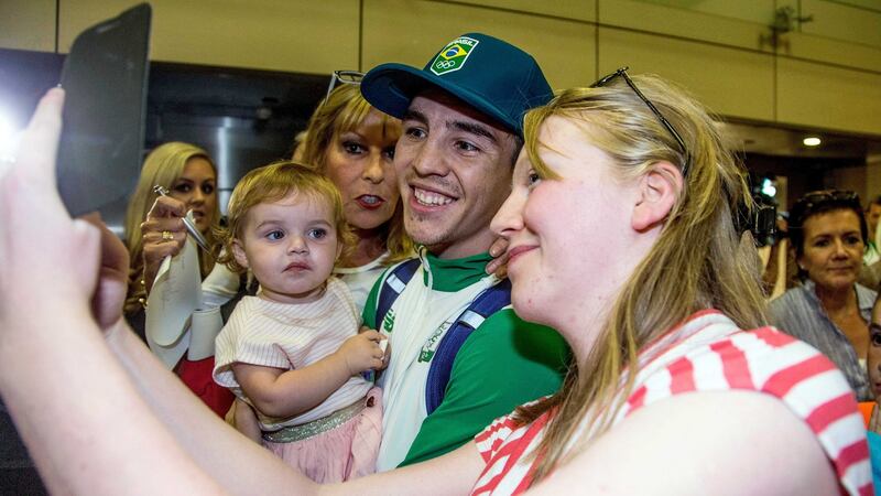 Boxer Michael Conlan takes photographs with fans. Photograph: INPHO/Tommy Dickson