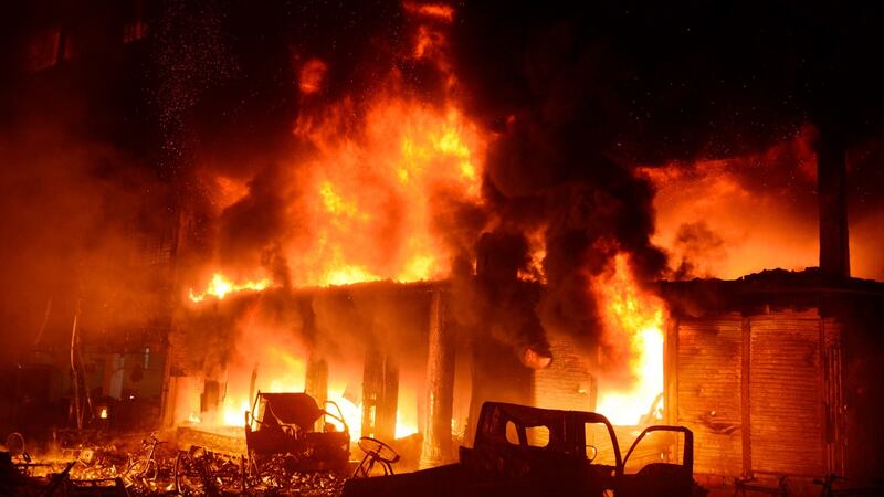 Firefighters try to douse flames in Dhaka, Bangladesh. Photograph: AP